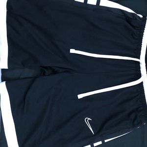 Black Nike shorts athletic for men, size large.